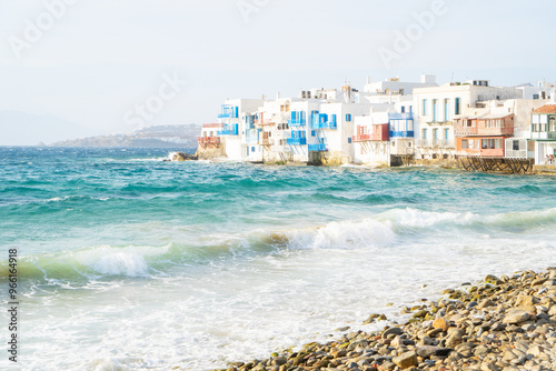 sea and seaside cafe table at Mykonos island, Greece at summer photo