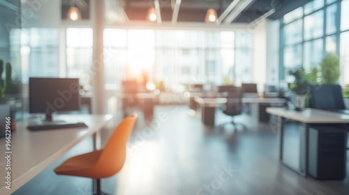 Bright, blurred modern office space showcasing a productive work environment during daytime