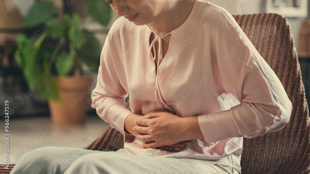 Fototapeta premium Unhealthy young woman with stomachache