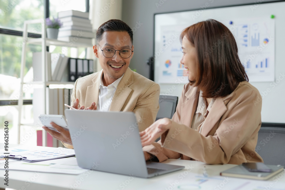 Business team working together on laptop having corporate meeting in modern office Business team working together on laptop having corporate meeting in modern office