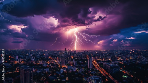 Fierce Lightning Storm Over City with Purple Hue