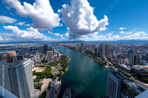 A view from the top of Umeda Sky Building, capturing Osakaâ€™s sprawling cityscape and the Yodogawa River cutting through the skyline photo