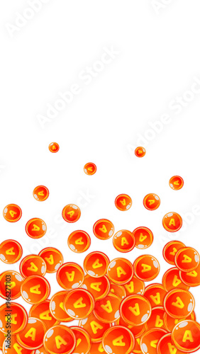 Vitamin A round capsules scattered randomly.
