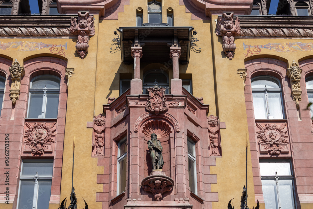Piotrkowska street, famous cult place with decorative historic house under Gutenberg, Lodz, Poland