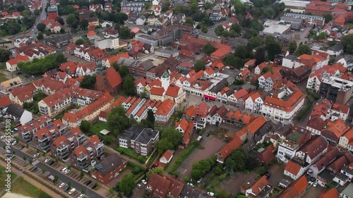 An Aerial around the downtown of the city Verden  on a cloudy summer day in Germany.	 photo