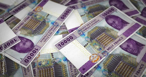 Central African CFA Franc money Cameroon Chad Congo growing pile of money. XAF banknotes loop rotaring. Seamless and looped background concept of finance, economy crisis, inflation and business.