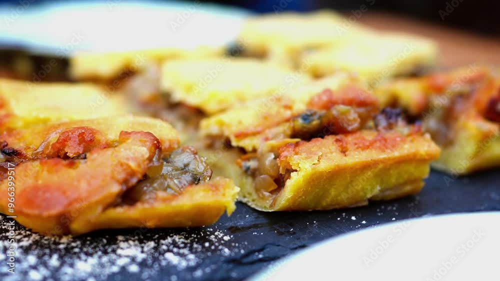 Empanada de millo de zamburiñas (Galician queen scallop empanada made with corn dough) at restaurant in Vigo, Spain Empanada de millo de zamburiñas (Galician queen scallop empanada made with corn dough) at restaurant in Vigo, Spain
