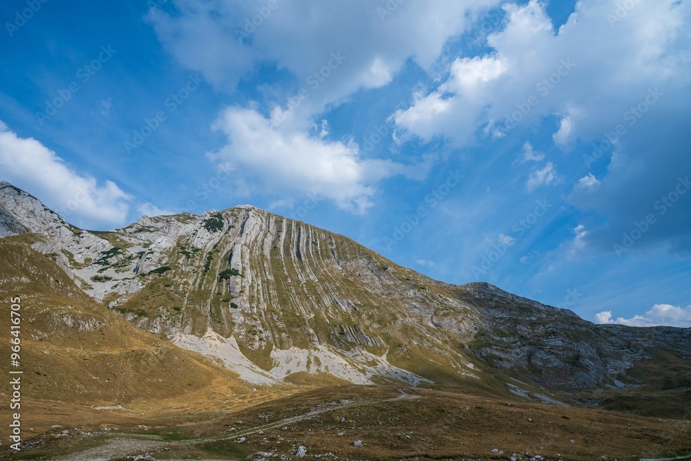 Rocky mountain ridge under a bright blue sky. Durmitor National Park. Montenegro Rocky mountain ridge under a bright blue sky. Durmitor National Park. Montenegro