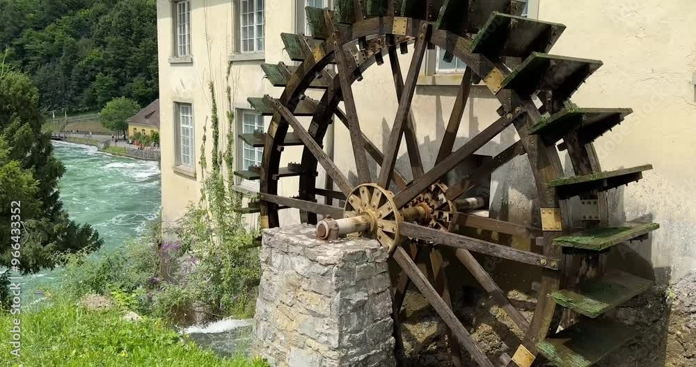 Old mill water wheel at the Neuhausen Rhine Falls - Switzerland Europe Old mill water wheel at the Neuhausen Rhine Falls - Switzerland Europe