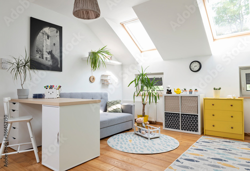 Cozy interior of room child with white color on the wall and yellow color in decor. Room in the attic with sofa, desk with chair and carpet in modern design on wooden floor. Scandinavian concept.	