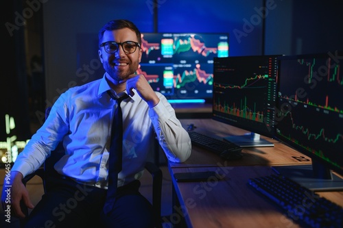 Financial Analysts and Day Traders Working on a Computers with Multi-Monitor photo