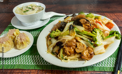 chinese noodles with vegetables, meat and mushrooms, chifa, peruvian food photo