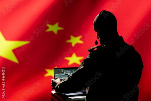 Chinese army expert analyzing aerial reconnaissance data to come up with tactics gaining battlefield advantage. China military soldier in command room controlling drones attacking strategic targets