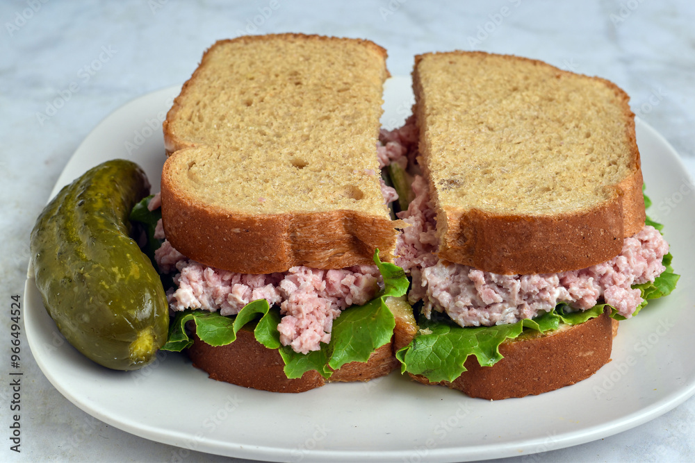 spam salad sandwich with an pickle on top spam salad sandwich with an pickle on top
