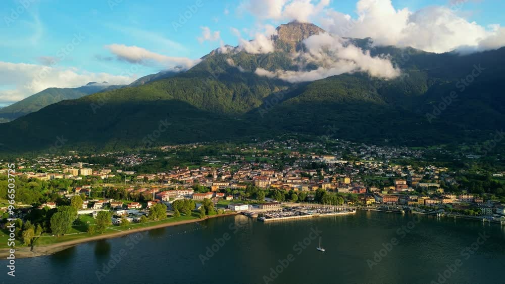 Aerial view of Colico town on Lake Como, Italy, at sunset, with mount Legnone in the background