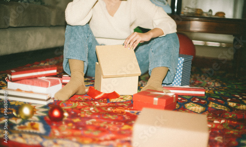 Holiday Gift Wrapping on Festive Carpet photo