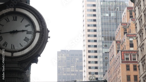 New York City Manhattan Midtown building architecture, urban street in United States. Residential and business real estate and street clock on 5th Fifth 5 avenue in USA. photo