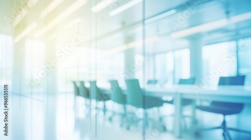 A blurred image of a modern office with a glass wall and a conference table. The image is soft and inviting, with a sense of calm and professionalism.