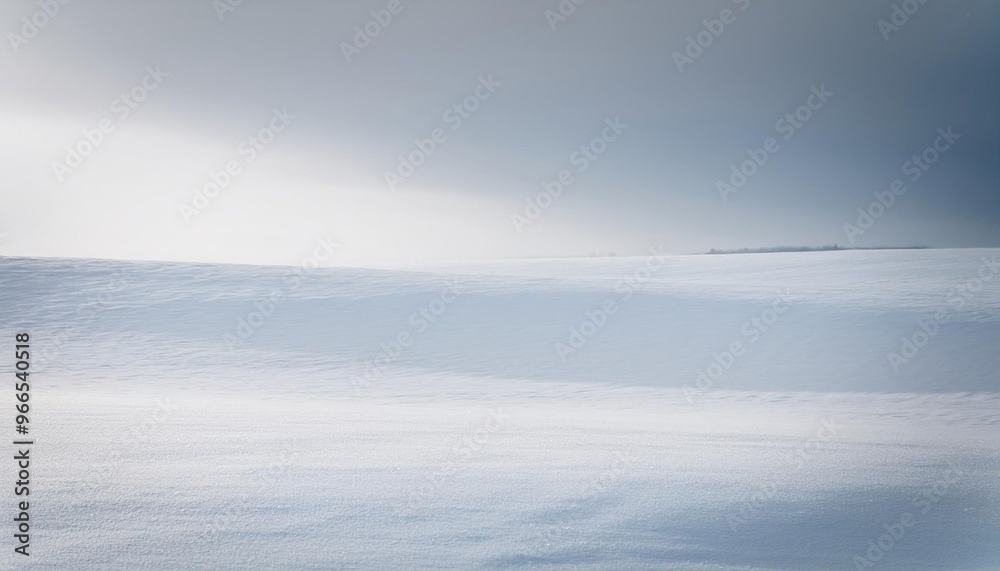 Snow covered field with a cloudy sky Snow covered field with a cloudy sky