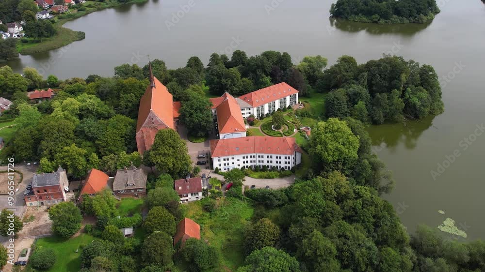 An Aerial around the monastery and the city Bordesholm on a late summer day in Germany. An Aerial around the monastery and the city Bordesholm on a late summer day in Germany.