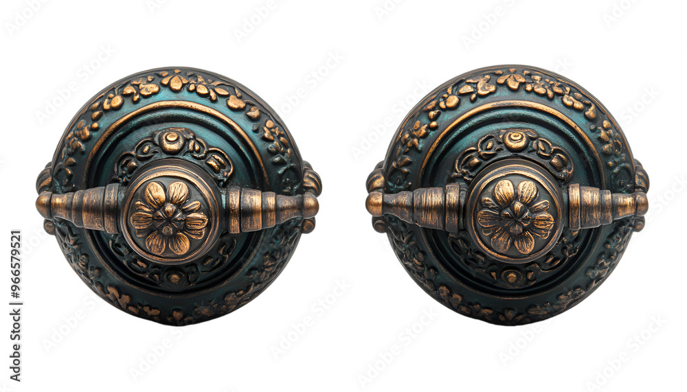Obraz premium Two antique door knobs featuring intricate, ornate designs, showcasing vintage craftsmanship and elegance.