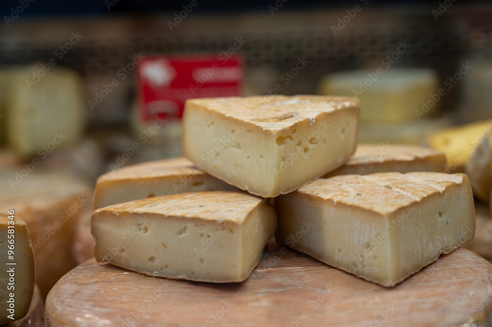 Farmer shop in Biarritz, France, Basque Country and Pyrenees sheep, cow and goat cheeses for sale, Tomme, Fermier Brebis, farmers cheese, close up Farmer shop in Biarritz, France, Basque Country and Pyrenees sheep, cow and goat cheeses for sale, Tomme, Fermier Brebis, farmers cheese, close up