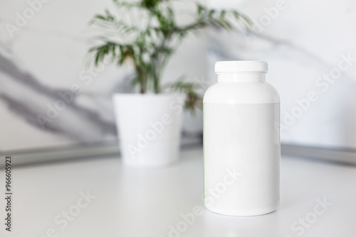 White blank plastic bottle for pills in kitchen interior