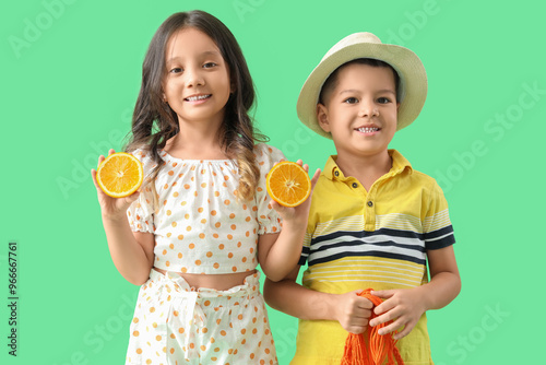 Little Asian children holdi...