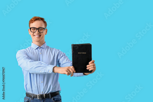 Young redhead man in eyegla...