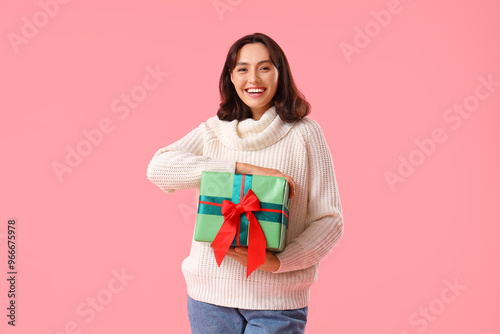 Young woman in warm sweater...
