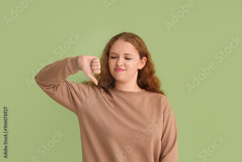 Young woman showing dislike...