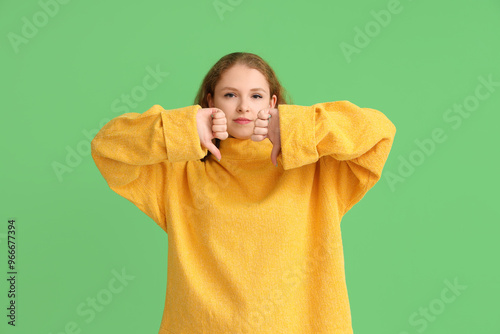 Young woman showing dislike...