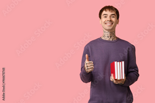 Young tattooed man with boo...