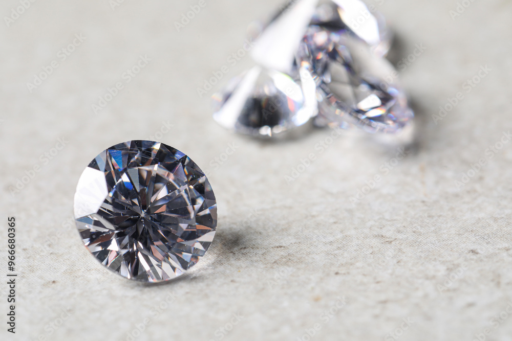 Many beautiful shiny diamonds on light background, closeup Many beautiful shiny diamonds on light background, closeup