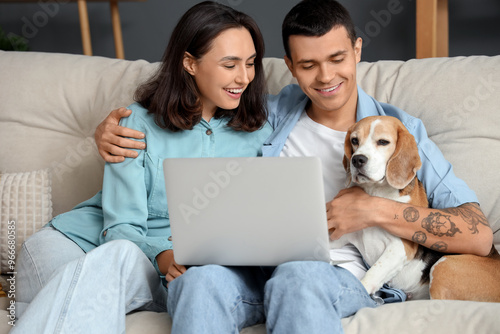 Young couple with cute Beag...