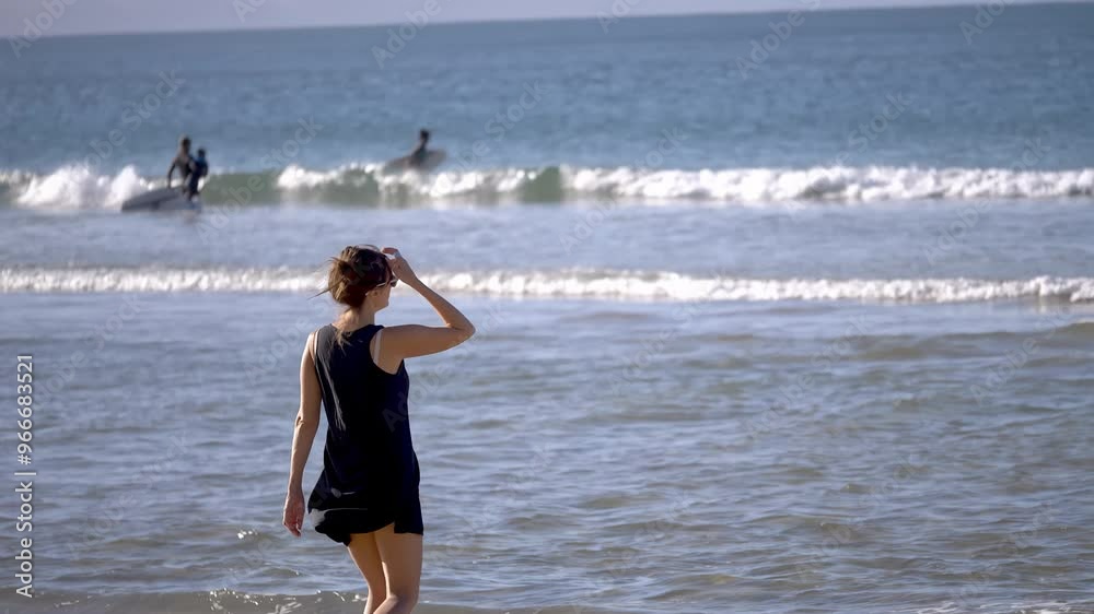 Beautiful Woman Walking on Marine Beach and Wet Legs Shape Moving Closeup. One Adult Girl at Bright Scenic Sea Going Swim or Splash. Modern Romance of Ocean Bathing and Amazing Summer Sky at Sundown Beautiful Woman Walking on Marine Beach and Wet Legs Shape Moving Closeup. One Adult Girl at Bright Scenic Sea Going Swim or Splash. Modern Romance of Ocean Bathing and Amazing Summer Sky at Sundown