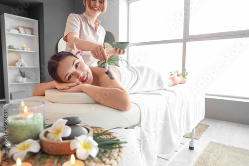 Massage therapist applying ...