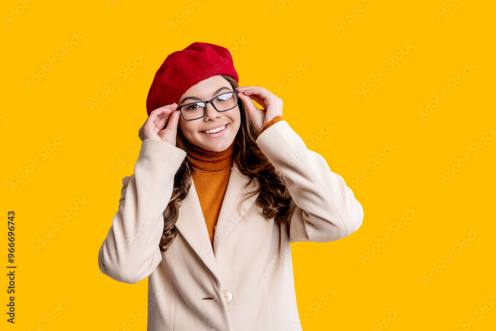 Autumn mood of adolescent model. Autumn fashion girl isolated on yellow. Trendy and stylish girl. Autumn teen girl wearing in glasses and beret. Fall season. Girl looks stylish in fall. Cozy textures Autumn mood of adolescent model. Autumn fashion girl isolated on yellow. Trendy and stylish girl. Autumn teen girl wearing in glasses and beret. Fall season. Girl looks stylish in fall. Cozy textures