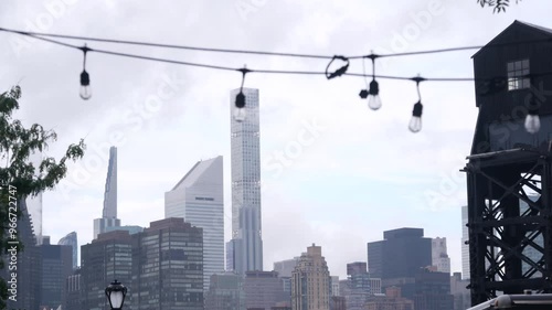 New York City waterfront skyline, Manhattan midtown, riverfront skyscrapers by East river water. Waterside cityscape view from Gantry Plaza dock pier, Long Island, Queens. United States architecture.