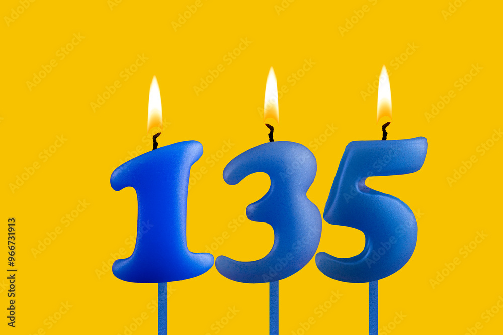 Blue candle number 135 - Birthday on yellow background Blue candle number 135 - Birthday on yellow background