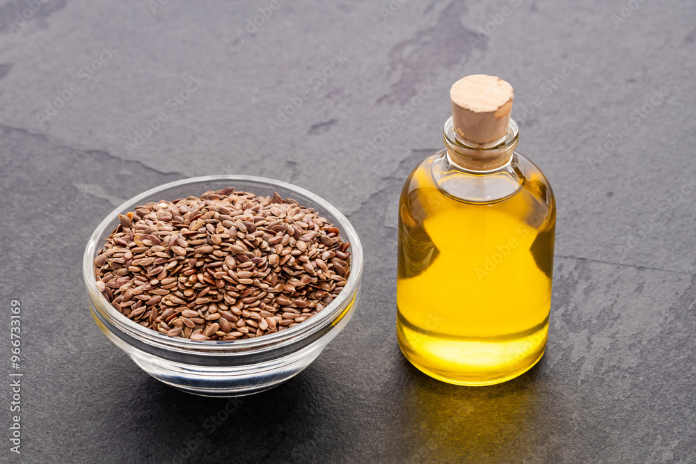 Flaxseed oil in bottle - Healthy Linum usitatissimum seeds.