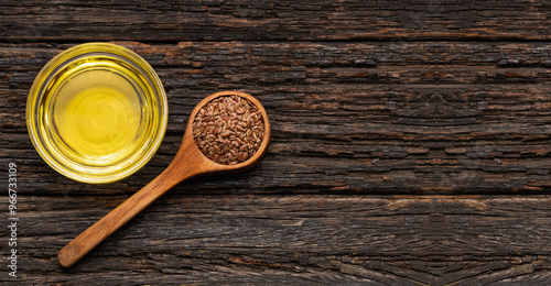 Organic flax seeds and oil in the glass bowl - Linum usitatissimum.