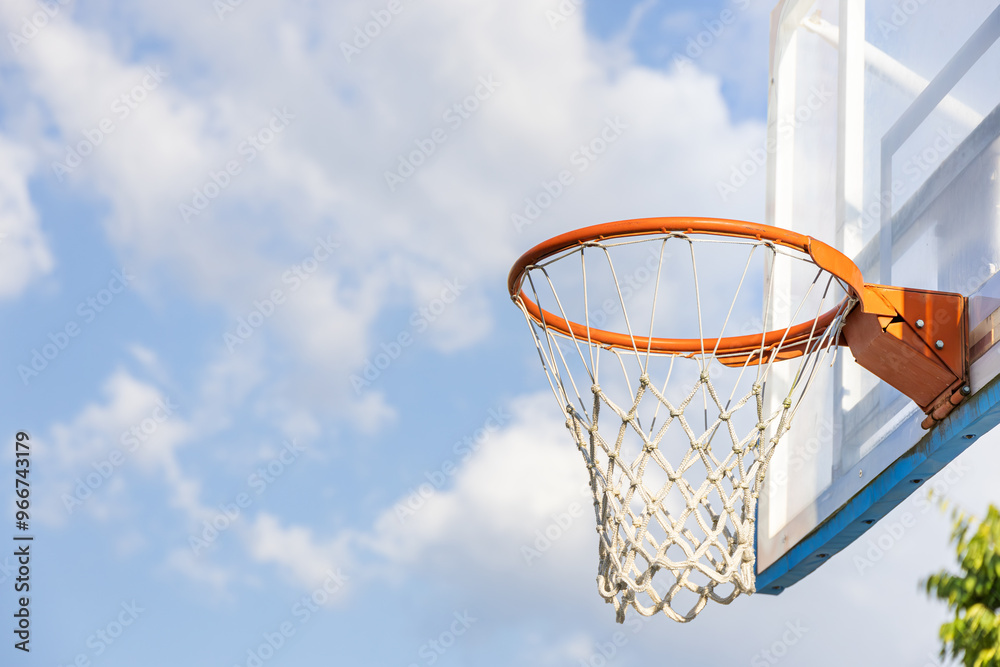 Close-up of a basketball hoop on a sunny afternoon. rim, net Close-up of a basketball hoop on a sunny afternoon. rim, net