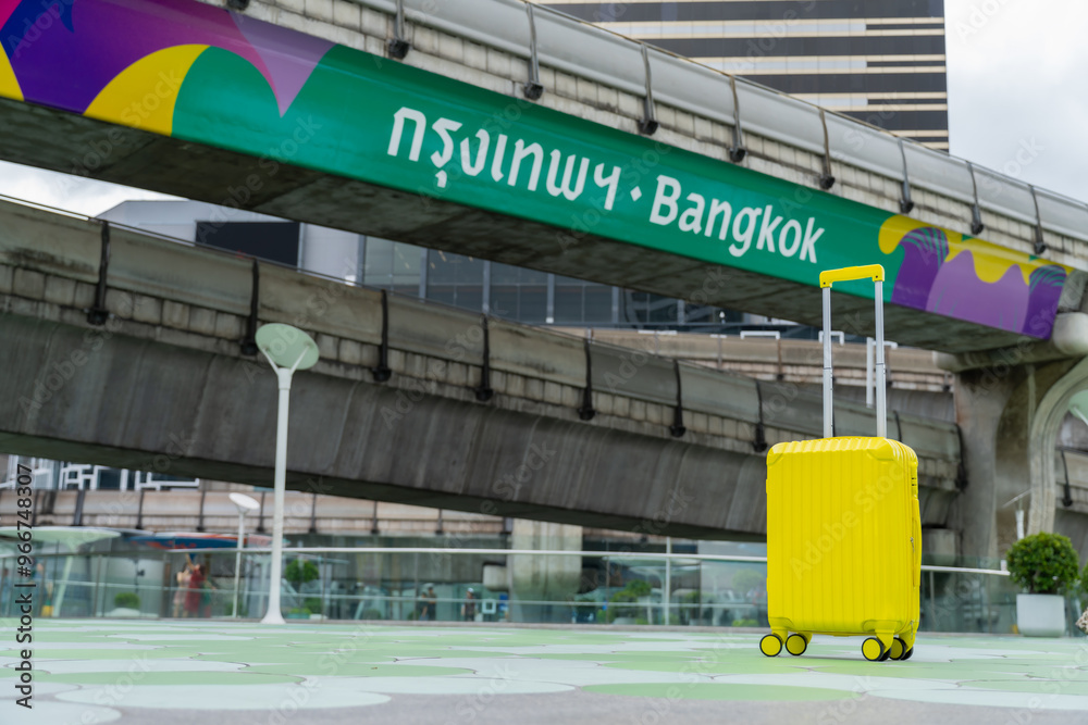 Obraz premium The suitcases in Sky walk of MBK Shopping Center.Famous destinations in Bangkok,Thailand, Landmark Tourism advertising logo on BTS sky train track, Thai word translation : Bangkok, vacation concept.