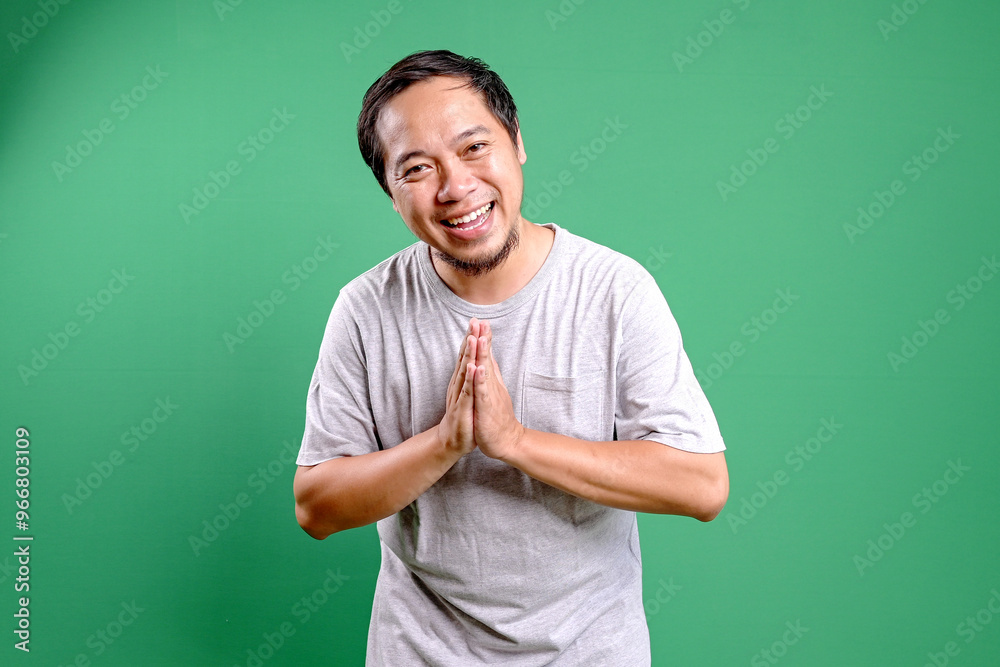 Excited Asian Man Showing With Welcome and Greeting Gesture or Begging About Something Excited Asian Man Showing With Welcome and Greeting Gesture or Begging About Something