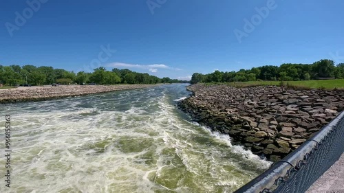 Downstream of the Saylorville Dam Outflow on the Des Moines River in Iowa: on average 2.7 million gallons of water per minute pass through the outflow conduit pipe; concepts of flood control photo