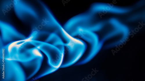 A vivid blue flame dances upwards, its soft curves creating a mesmerizing display against the stark black backdrop, highlighting its dynamic and ethereal nature