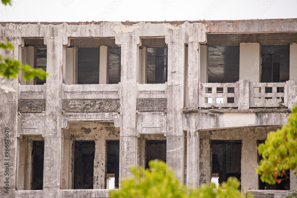 A large building with many windows and a balcony A large building with many windows and a balcony