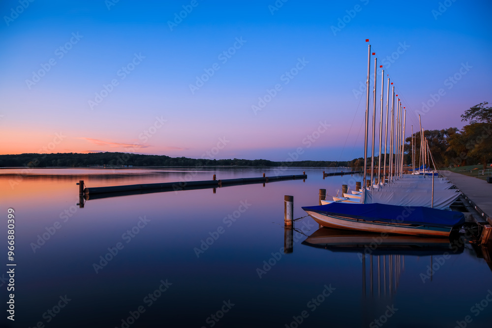 Scenic landscape of many sail boats at Kensington metro park in Michigan.