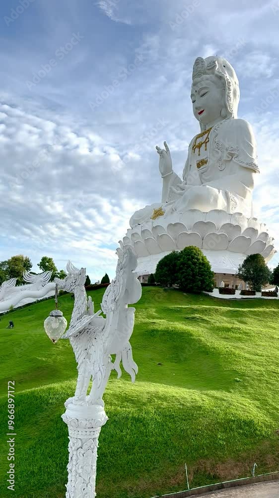 4K video footage of Wat Huay Pla Kang, or Temple of Goddess of Mercy, at Chiang Rai, Thailand. Big Guan Yin Buddha statue with its holy white temple, sitting on the hill mountain top.